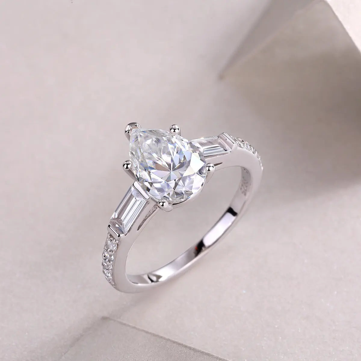 1.5CT Pear Moissanite Ring | Sterling Silver Side Stones LuxeStones