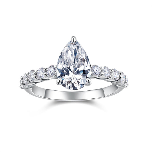 Diamond ring with pear-shaped center stone on a white background